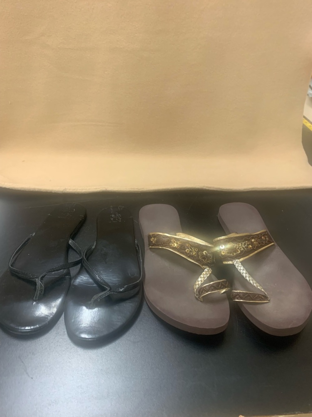 New York and Co black flip flops and also gold braided sandals with toe strap
